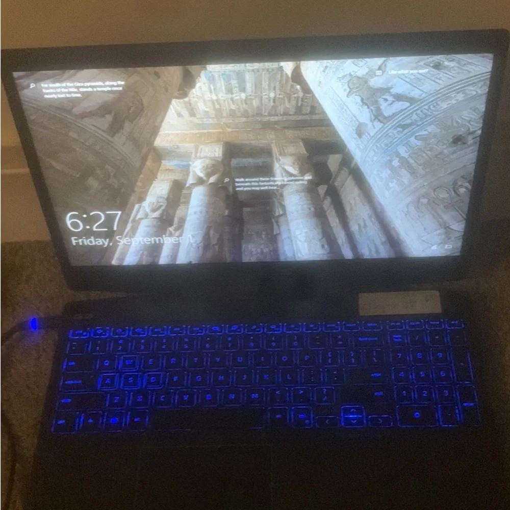 One black used dell laptop